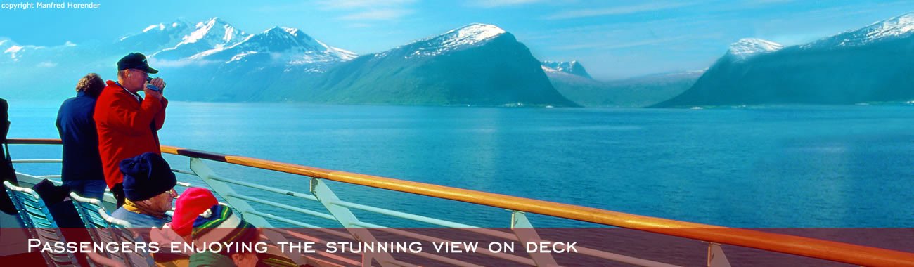 Passengers enjoying the stunning view on deck