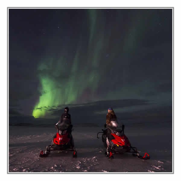 Snowmobiling under the Northern Lights Snowmobiling under the Northern Lights